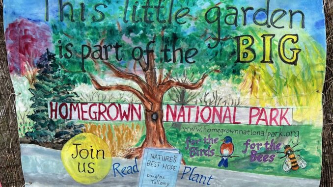 Banner centered on spreading tree. Text reads: This little garden is part of the Big Homegrown National Park. Join us. Read "Nature's Best Hope." Plant